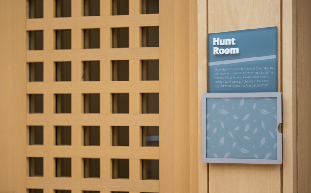 Hunt Room sign with sign pad on wooden wall at Victoria location.