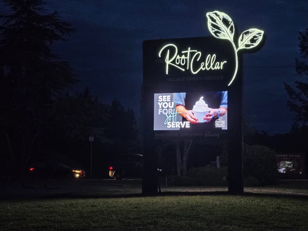 Illuminated digital sign for Root Cellar with leaf logo in Victoria.