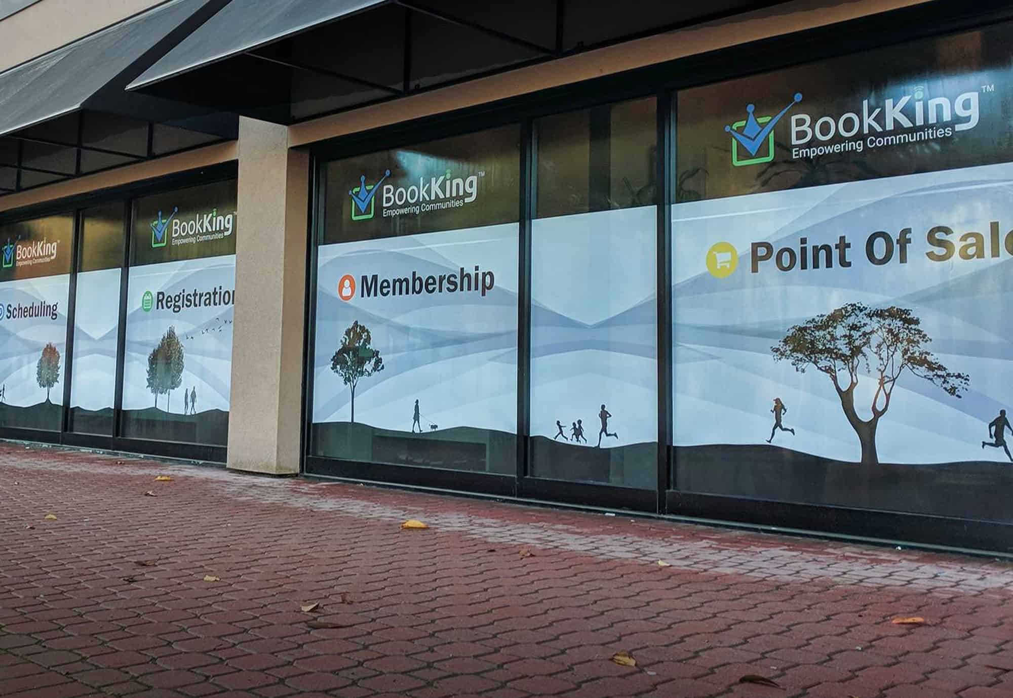 Custom window and wall graphics for BookKing promoting membership and point of sale.