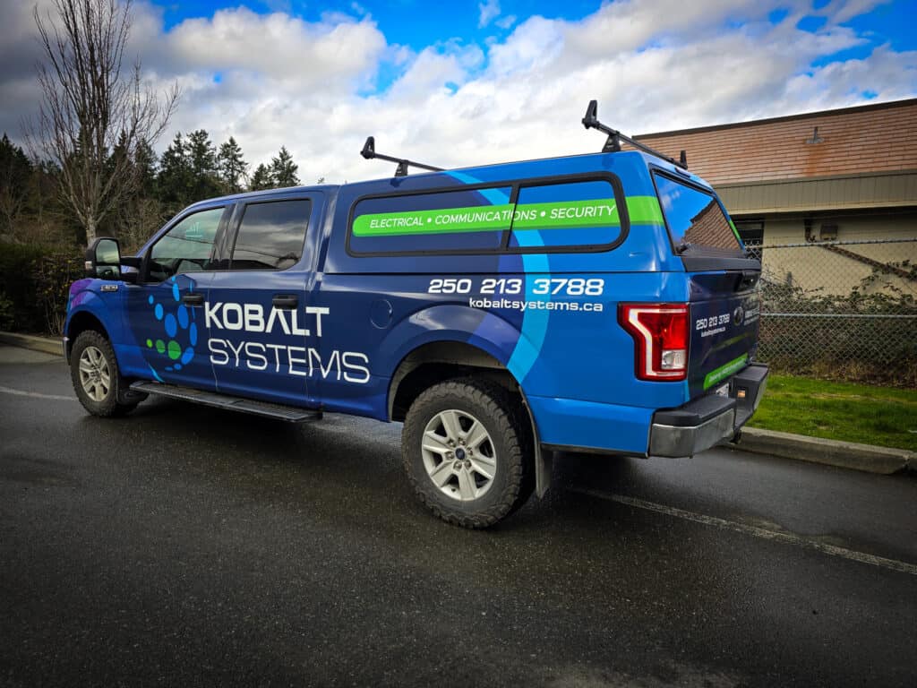 Custom vehicle wrap for Kobalt Systems promoting electrical, communication, and security services.