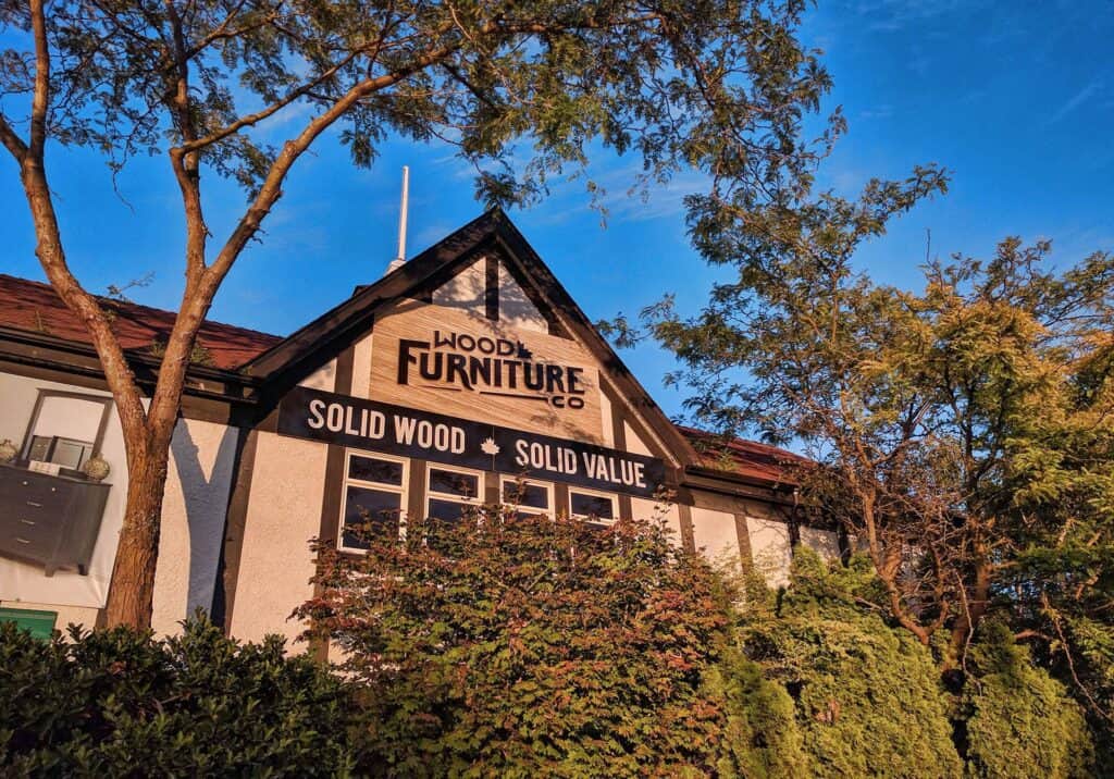 Wood Furniture Co sign on building facade.
