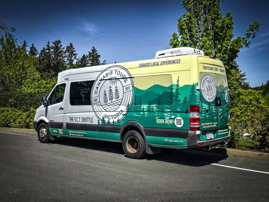 Cannabis tour vehicle with custom graphics in Victoria, promoting local experiences and bookable tou.
