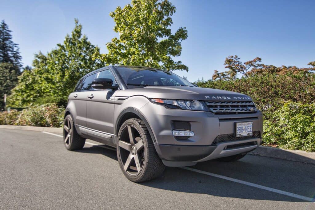 Range Rover SUV parked outdoors with trees in the background.