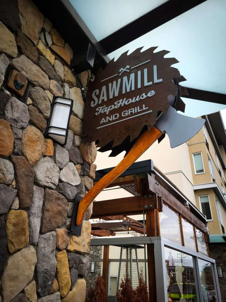 Custom sawmill-shaped sign for Sawmill Tap House and Grill in Victoria.