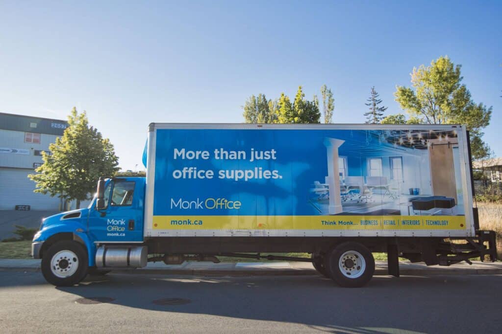 Custom vehicle wrap for Monk Office promoting office supplies and services.