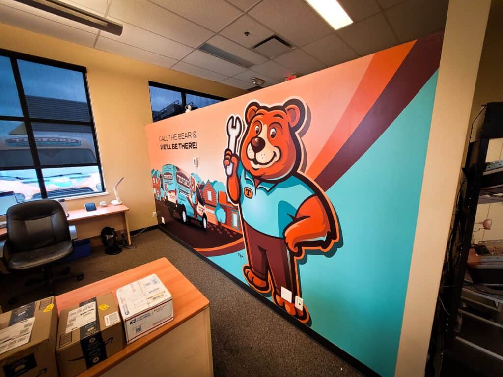 Custom bear character wall mural for signage and branding in Victoria.