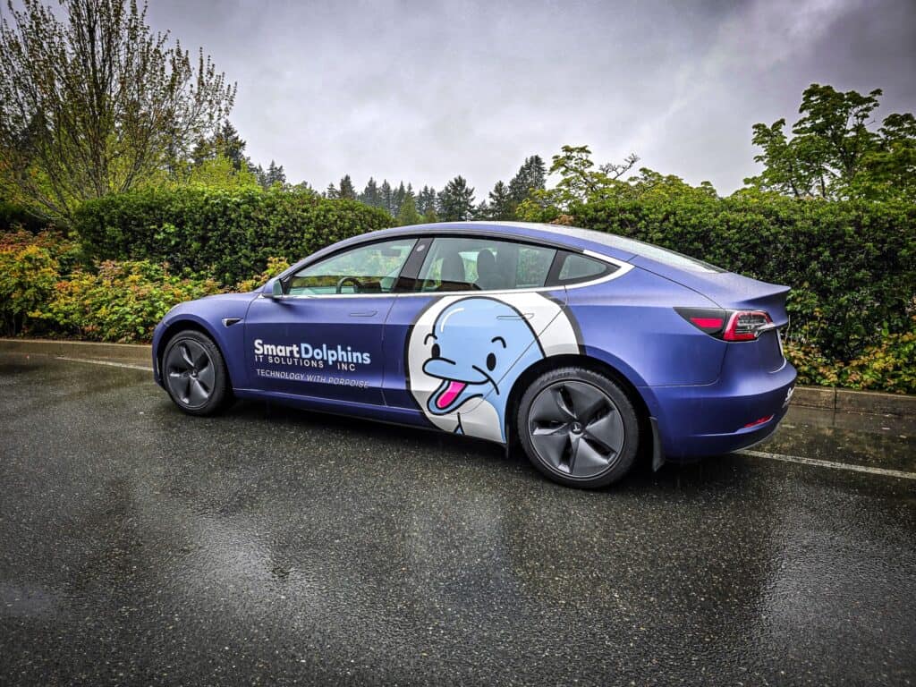 Vehicle wrap with dolphin logo for Smart Dolphins IT Solutions.