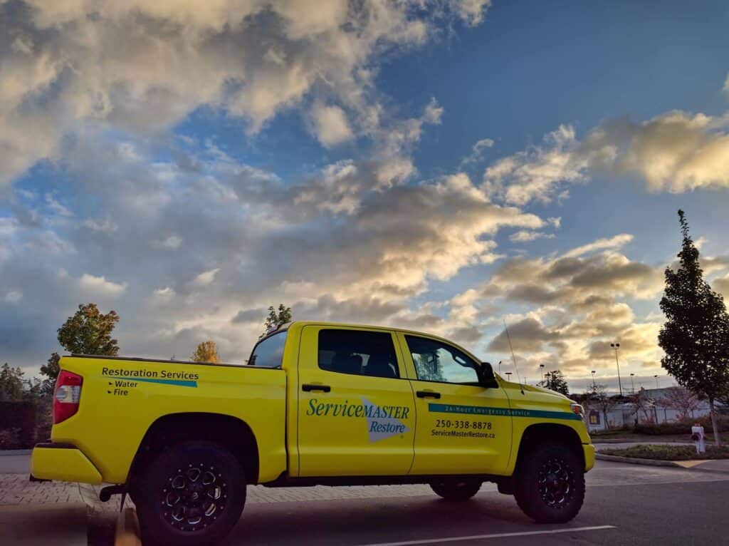 Restoration services truck with custom signage and vehicle wrap in Victoria.