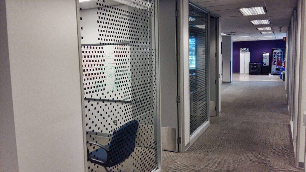 Interior view of a commercial space with custom signs and vehicle wraps in Victoria.