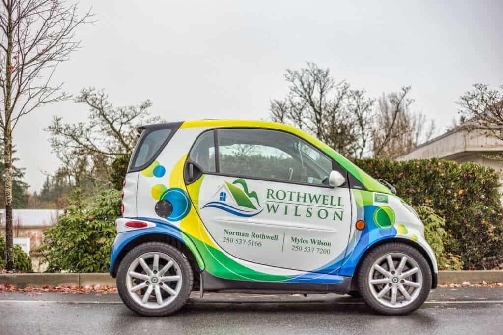 Custom vehicle wrap for Rothwell Wilson on a compact car.