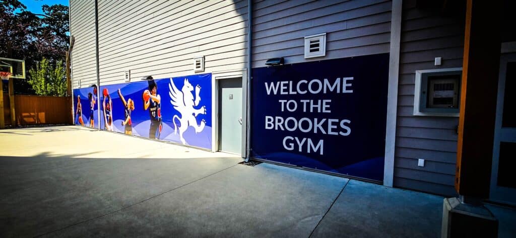 Custom gym sign with "Welcome to the Brookes Gym" in Victoria, featuring vibrant graphics and brandi.