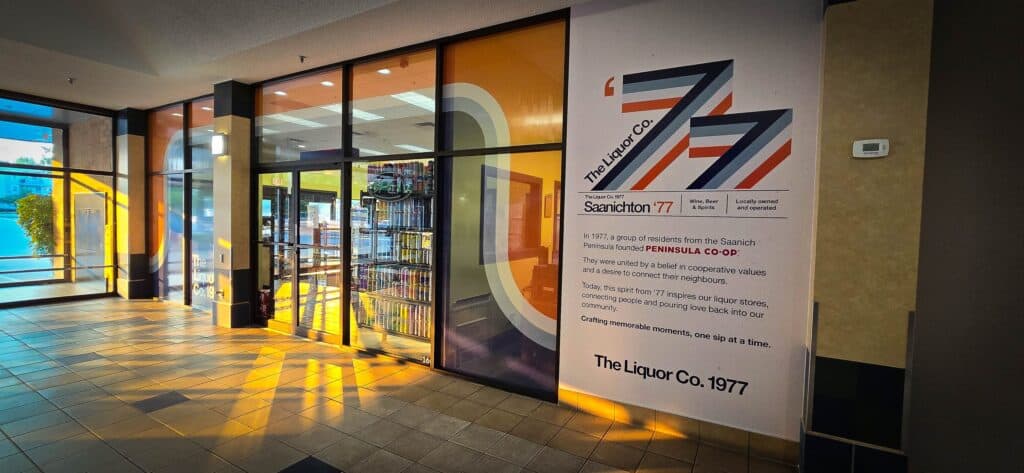 Modern storefront window display with custom signs and vibrant colors in Victoria.