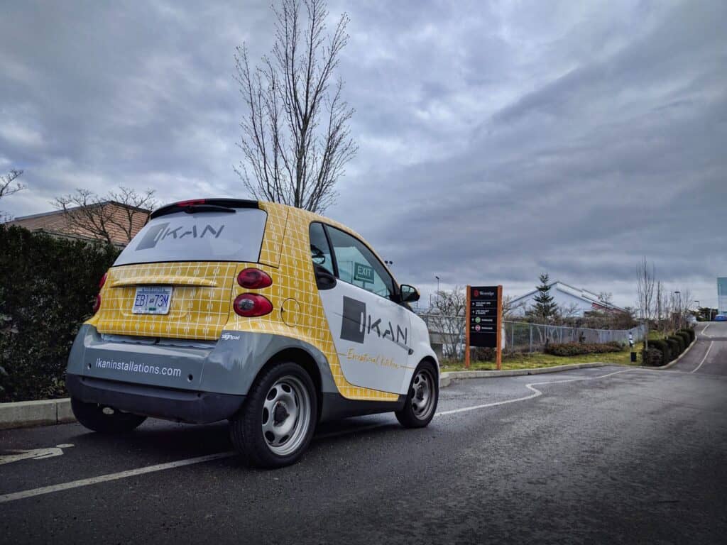 Custom vehicle wrap for The Sign Pad in Victoria, featuring vibrant yellow and white design.