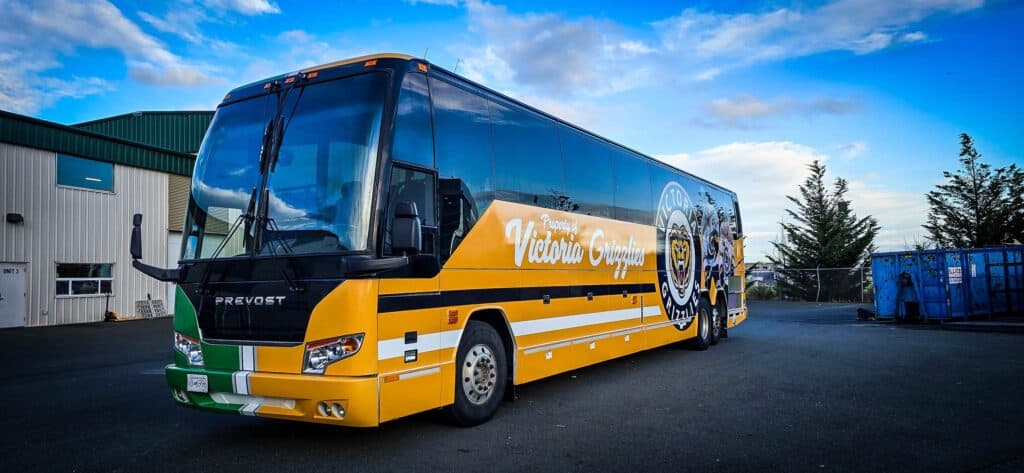 Bus with custom vehicle wraps and signage for Victoria Group.