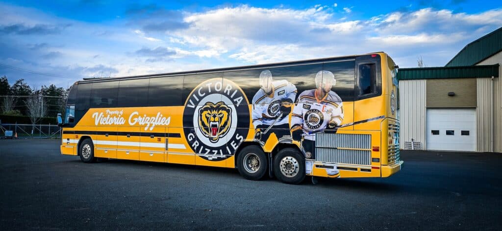 Custom Victoria Grizzlies bus wrap with team logo and graphics.