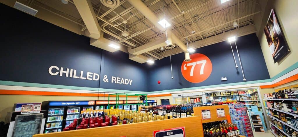 Interior view of a retail store with custom signage and vibrant branding elements.