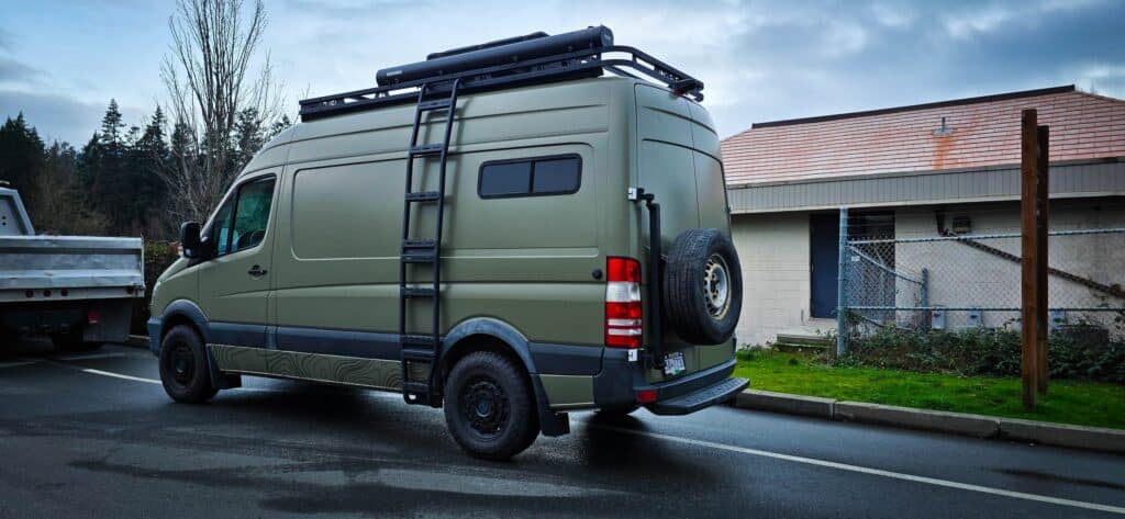 Custom vehicle wrap on a green van in Victoria, showcasing professional signage.