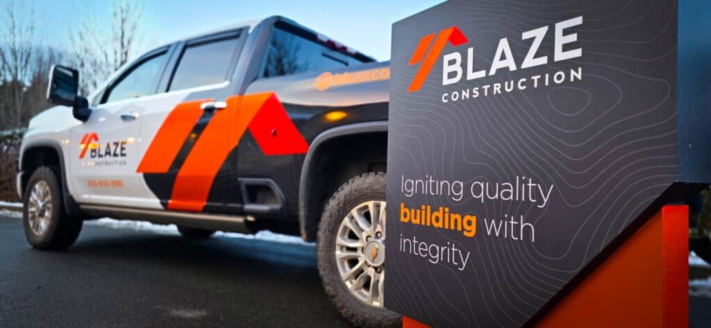 Vehicle wrap featuring Blaze Construction branding on a pickup truck.