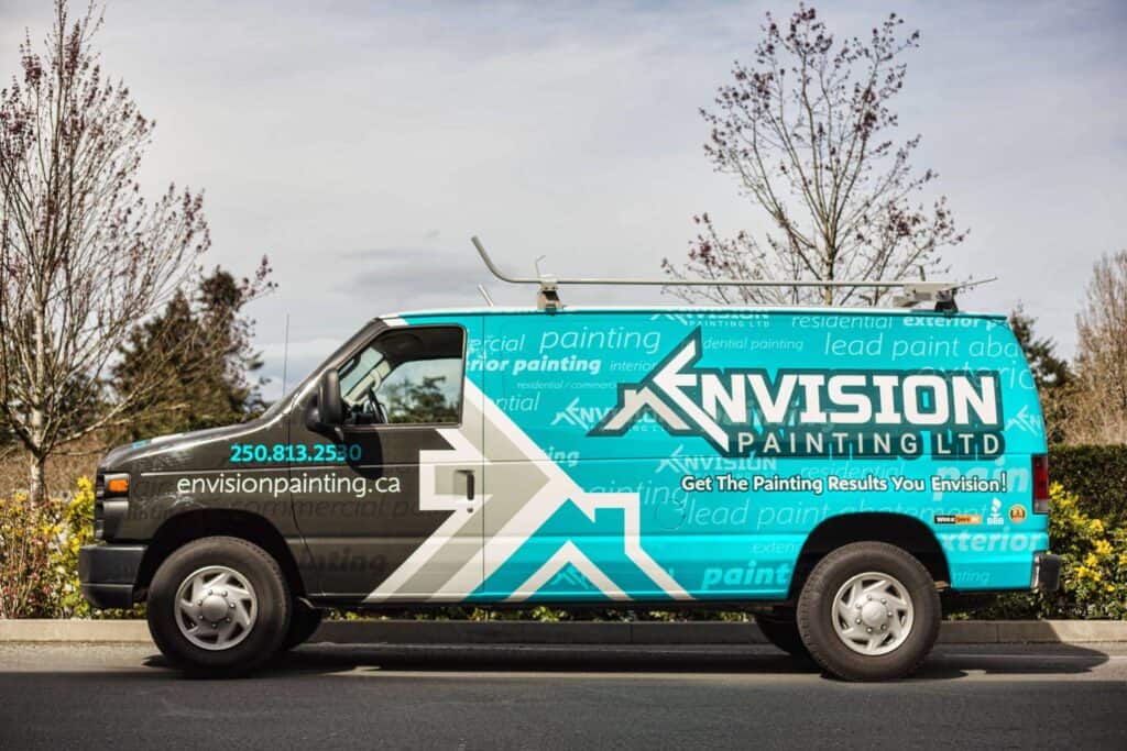 Custom painted van for Envision Painting with company logo and contact info.