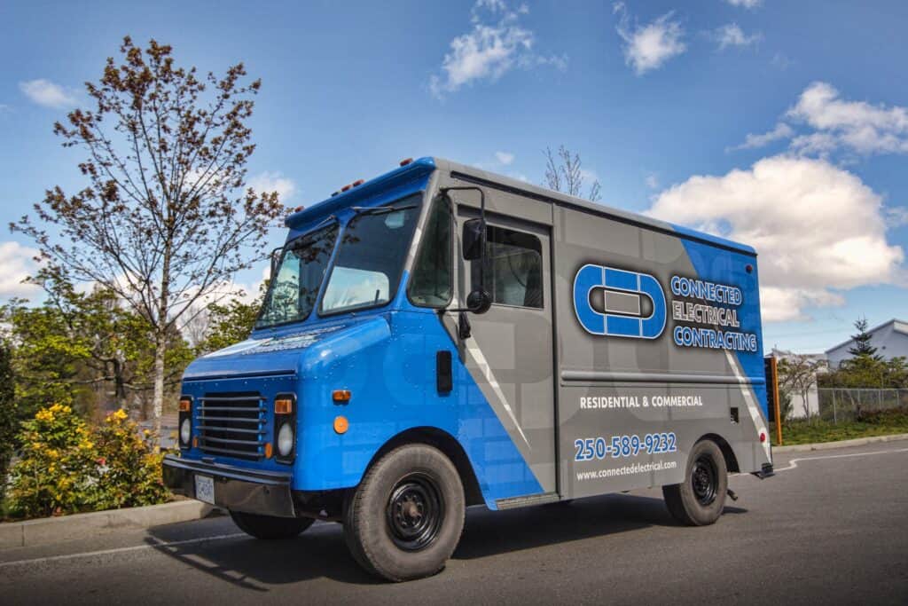 Blue service truck with company logo and contact info.