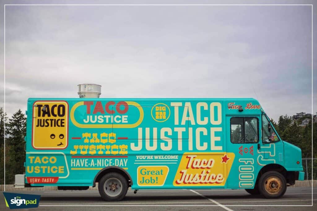 Custom Taco Justice food truck with vibrant signage in Victoria.