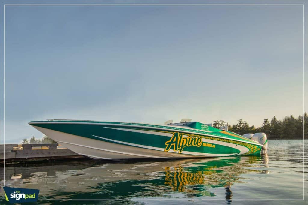 Speedboat featuring Alpine Marine branding on calm water surface.