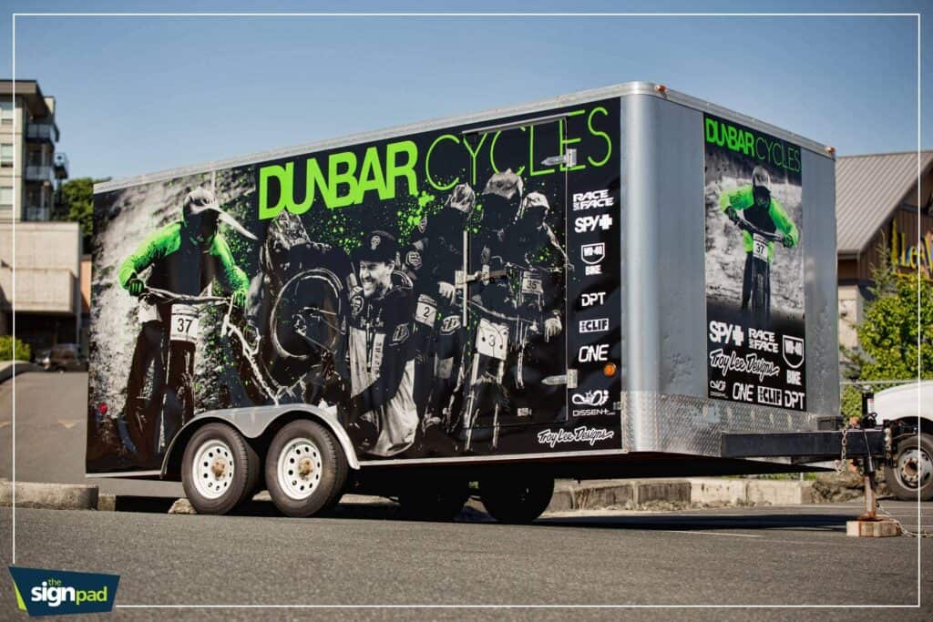 Custom vehicle wrap for DUBAR CYCLES featuring cyclists and branding.