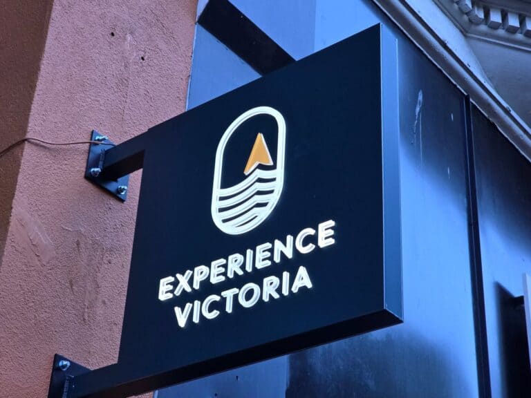 Experience Victoria sign with wave and arrow logo for custom signs and vehicle wraps.