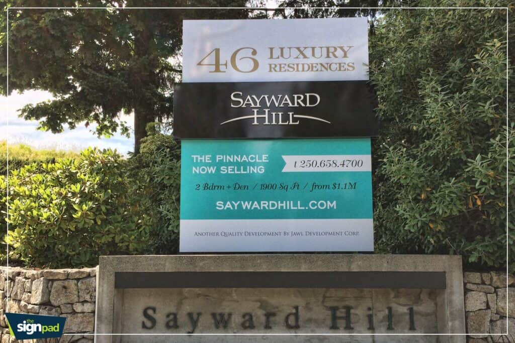Luxury residence sign for Sayward Hill with property details and website.