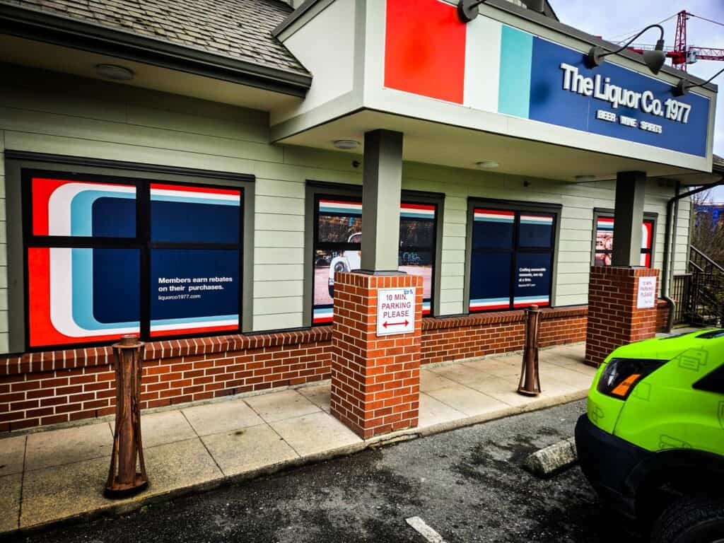 Custom liquor store signage with bold logo and colorful design in Victoria.
