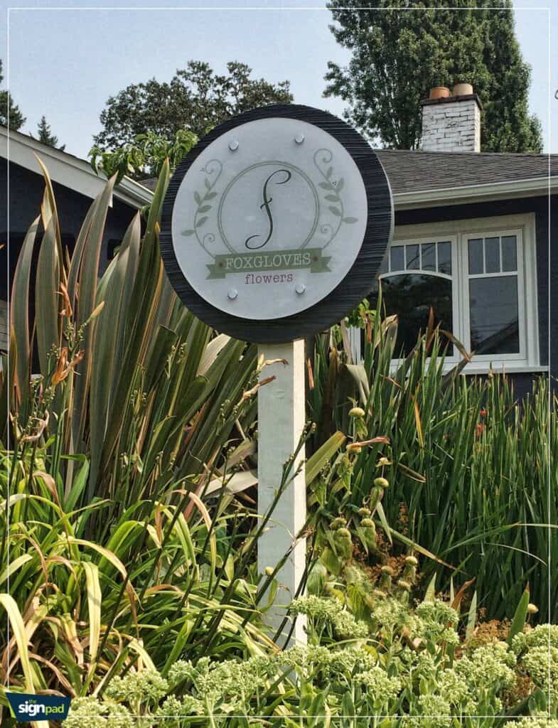 Custom outdoor sign for Foxgloves Flowers with elegant logo design.