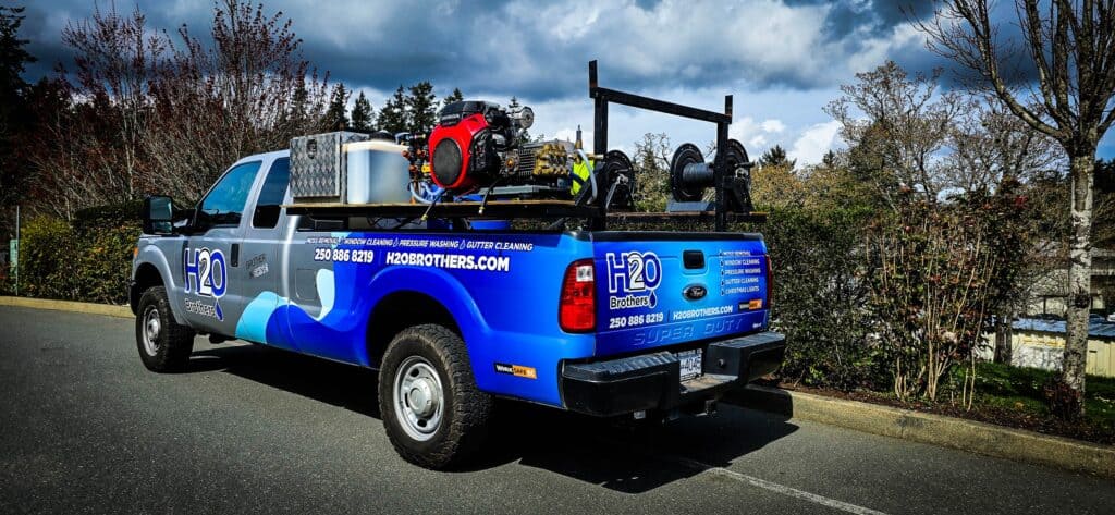 H2O vehicle wrap on a pickup truck promoting water-related services in Victoria.