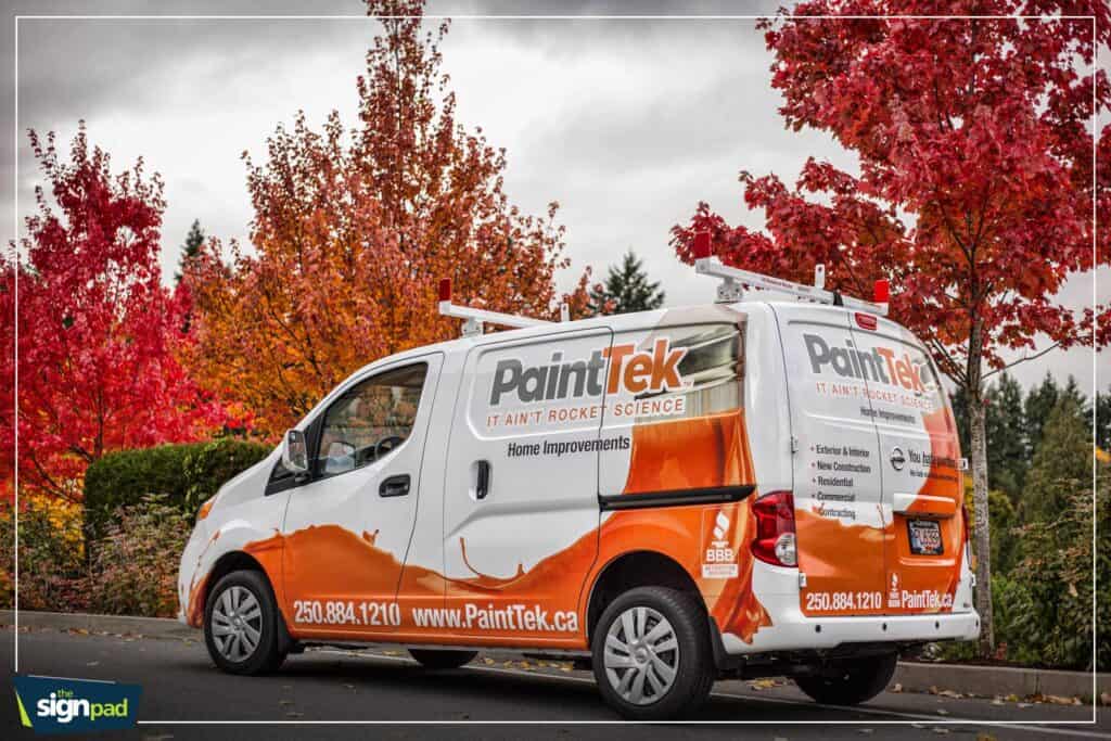 Custom vehicle wrap for PaintTek on a white van in autumn scenery.