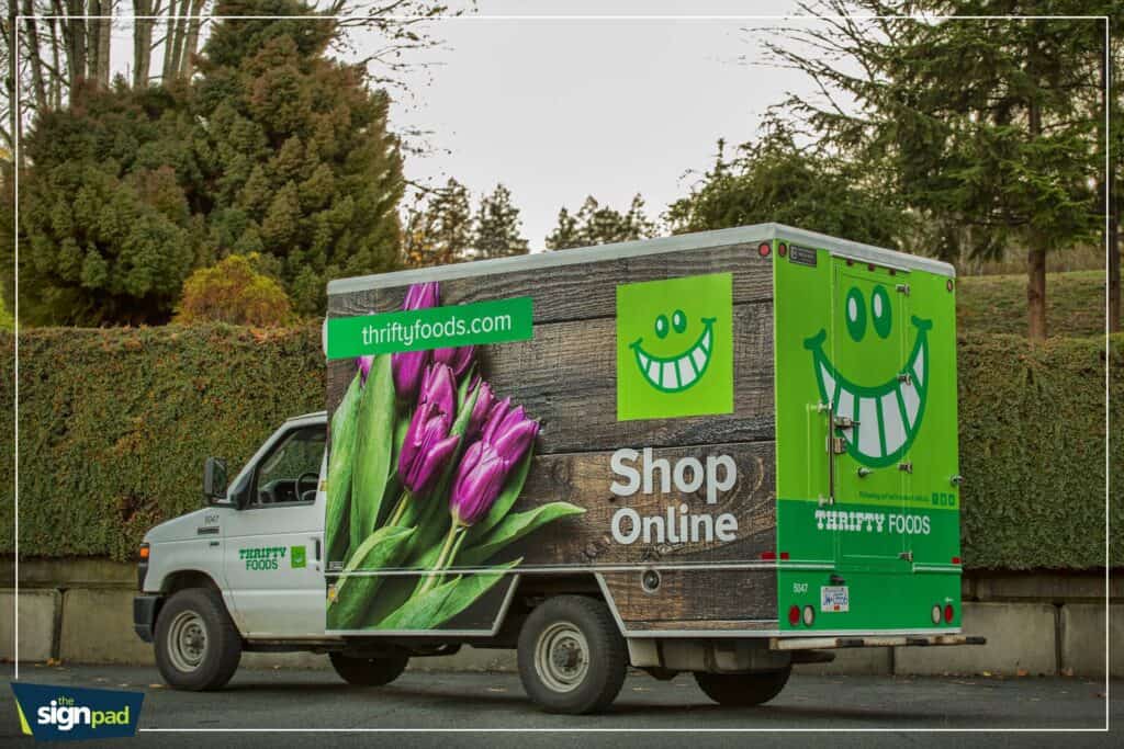 Custom vehicle wrap for Thrifty Foods with tulip design and logo in Victoria.