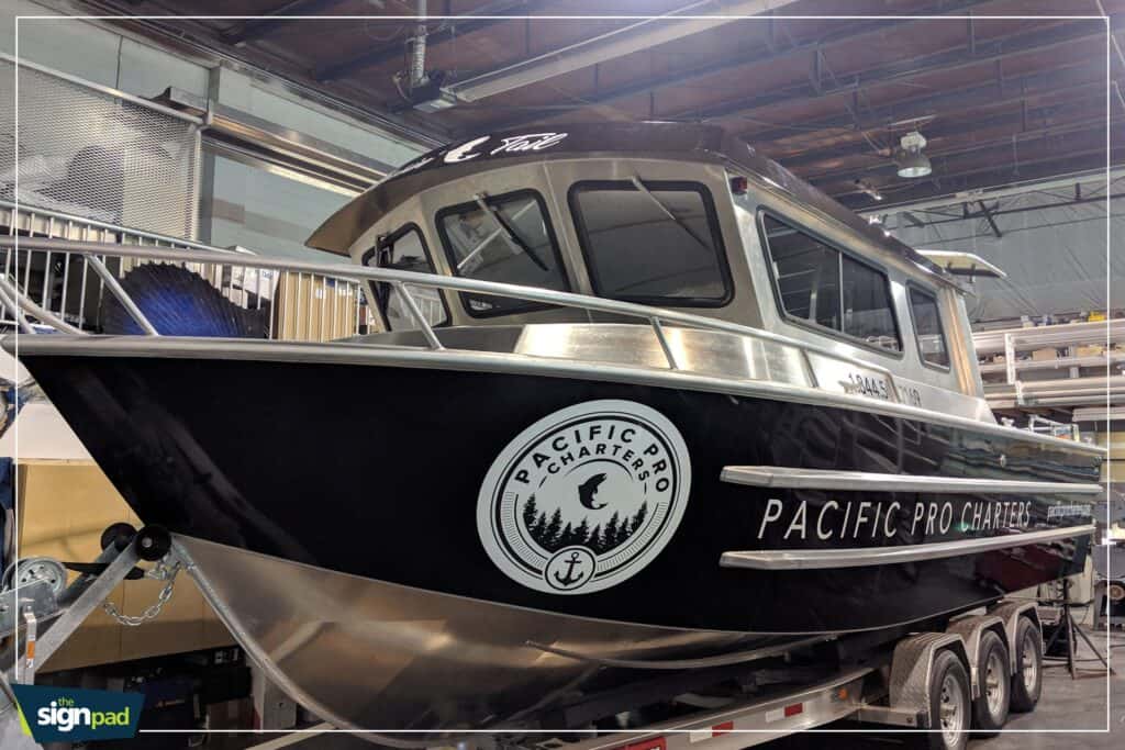 Boat sign with Pacific Pro Charters logo and branding.