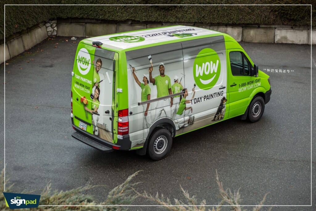 Custom vehicle wrap for WOW Day Painting featuring vibrant graphics and team images.