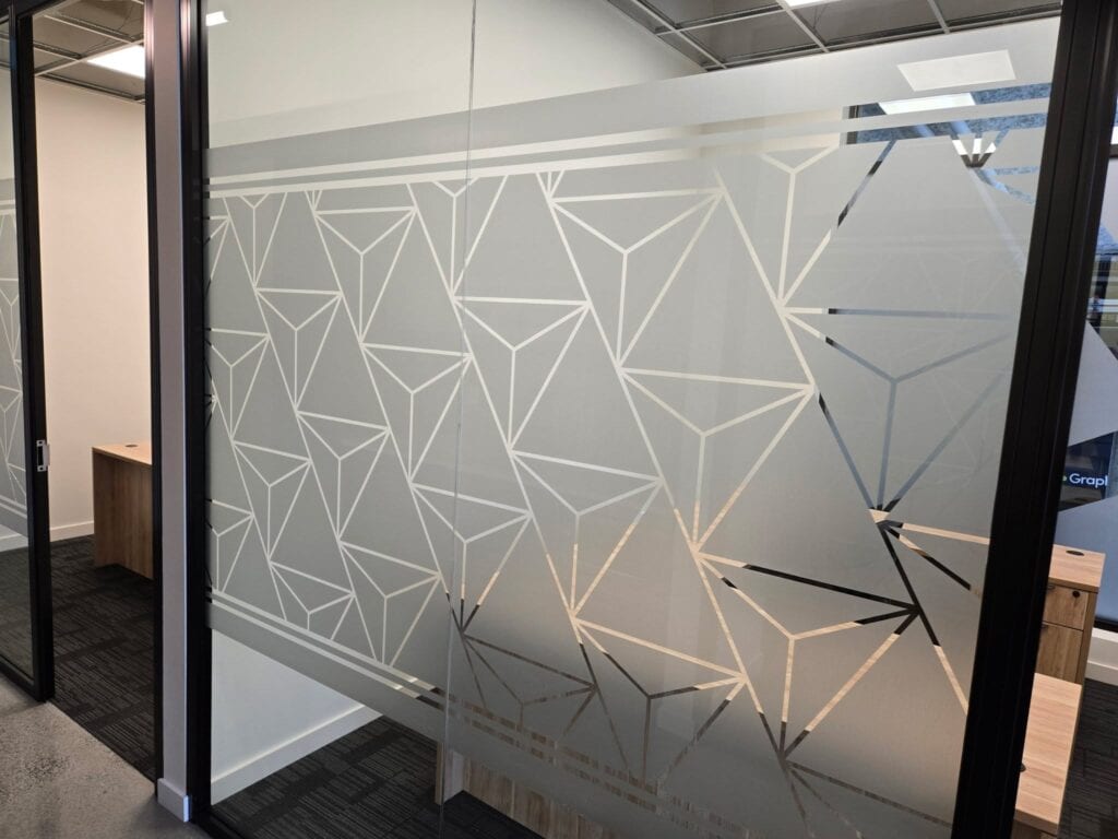 Sign Pad with geometric frosted glass pattern in a modern office setting.