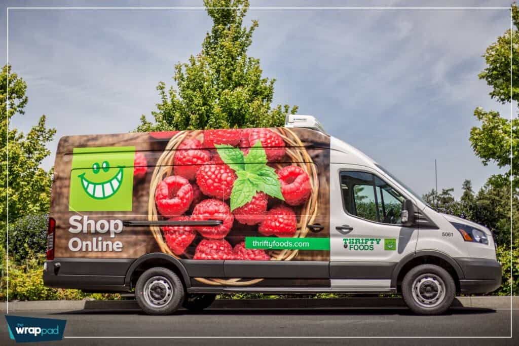 Food truck with vibrant raspberry and mint leaf design for Thrifty Foods.