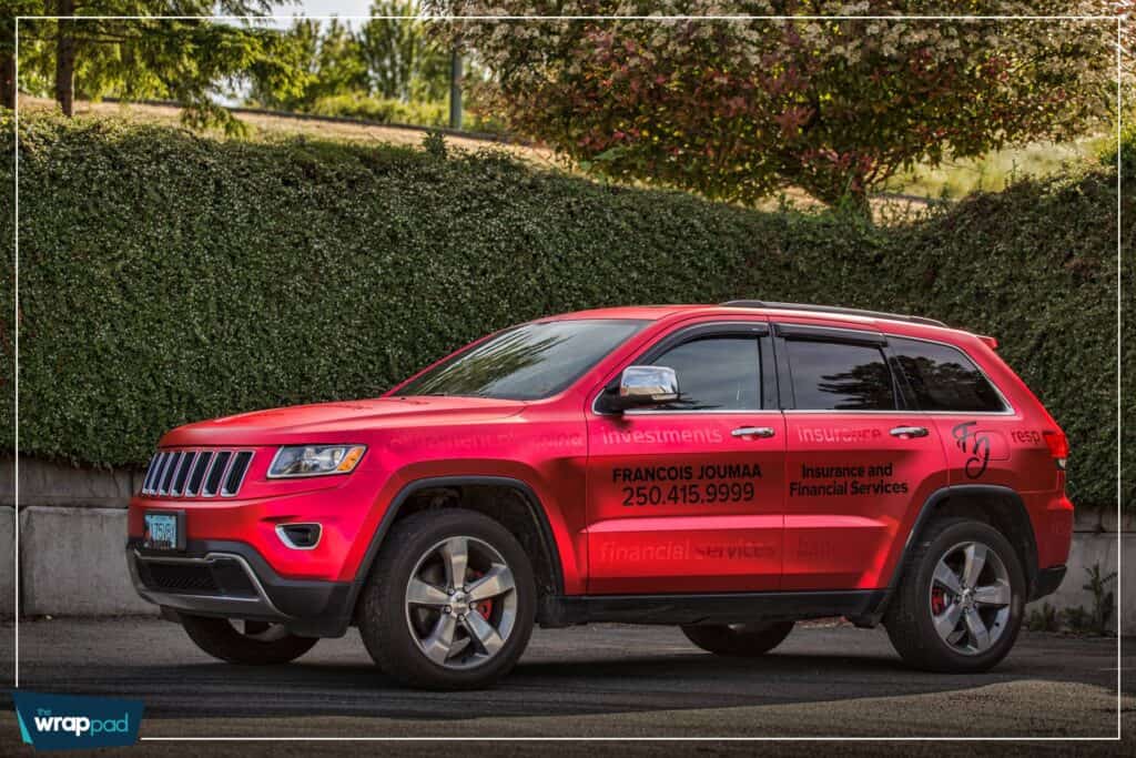 Insurance vehicle wrap with company branding and contact info.