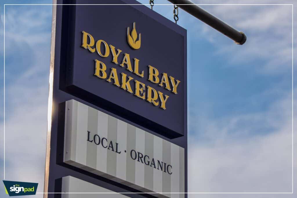 Custom bakery sign for Royal Bay Bakery with logo and organic label.