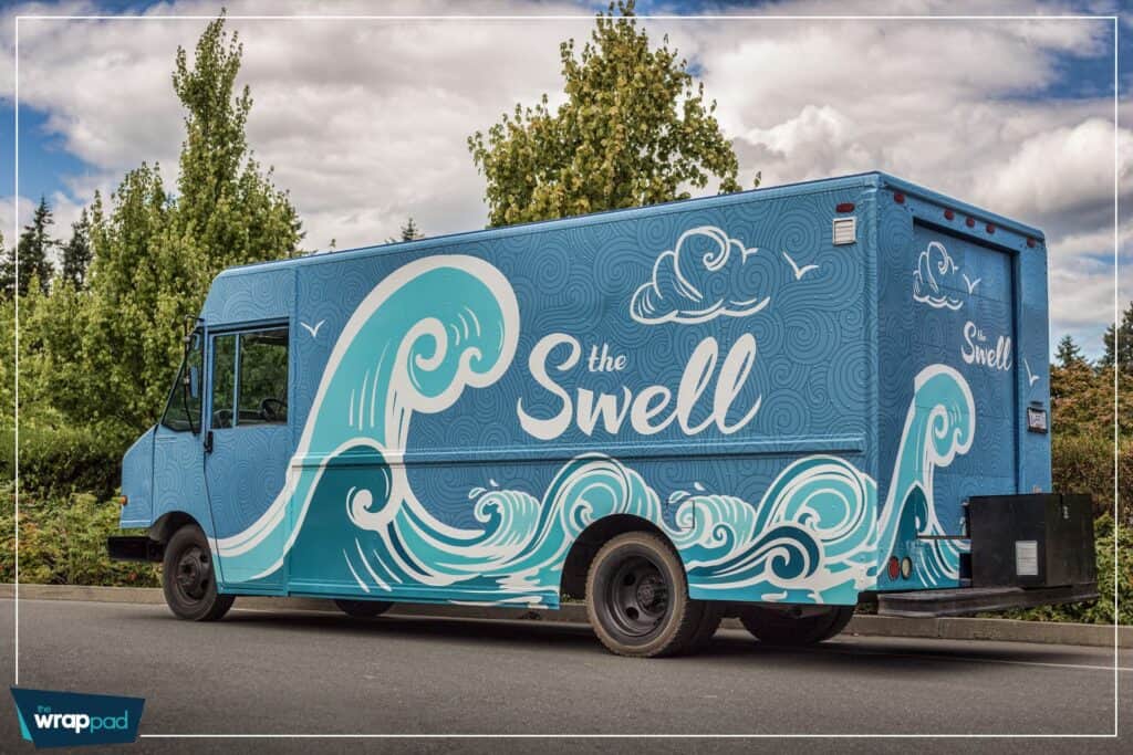 Custom vehicle wrap with ocean wave design for The Swell in Victoria.