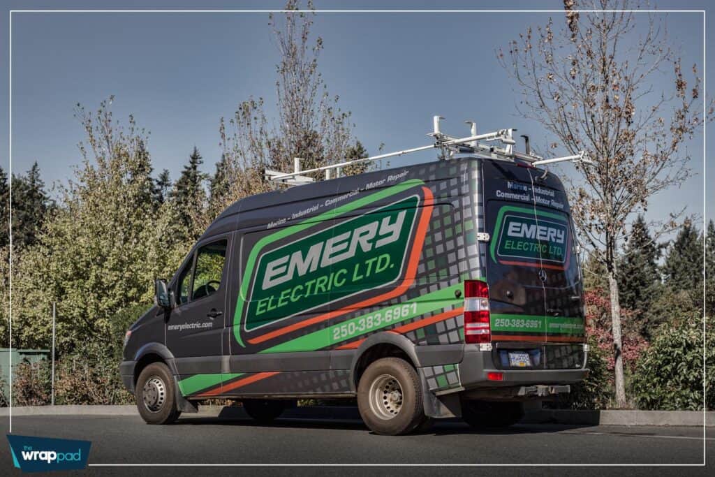 Vehicle wrap for Emery Electric Ltd. on a black van with green and blue branding.