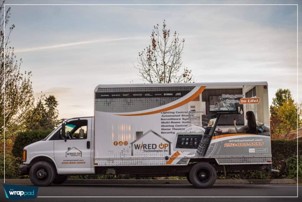 Vehicle wrap featuring a sign pad for advertising services.