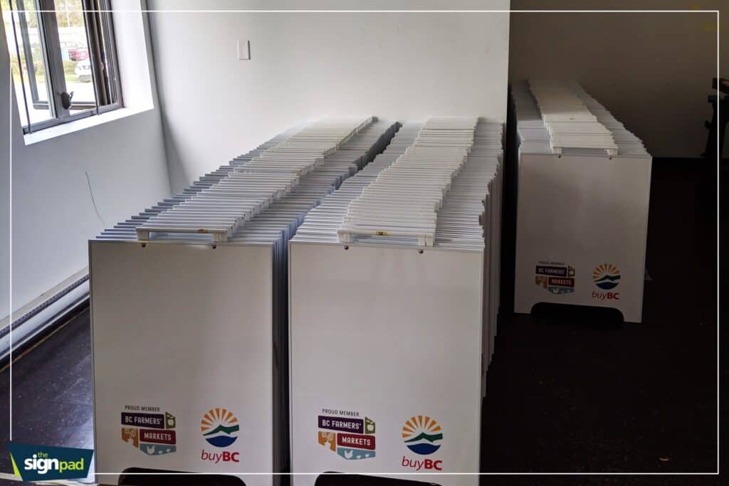 Display of multiple custom signs for vehicles and business branding.