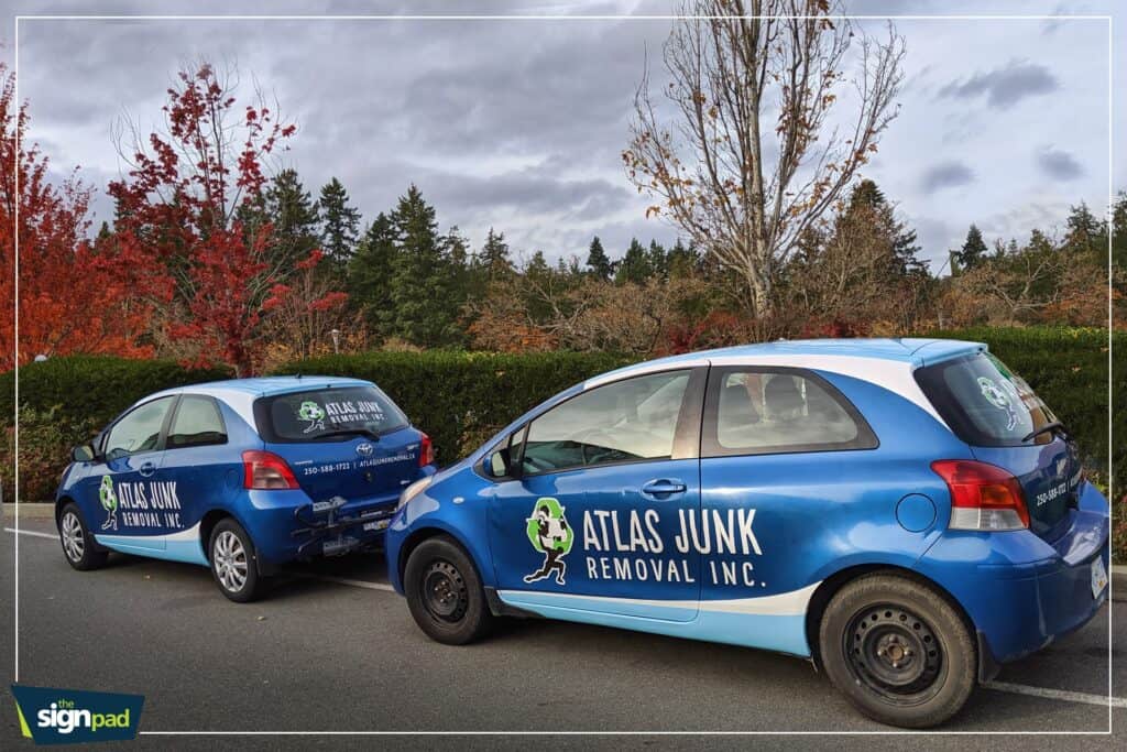 Custom vehicle wraps for Atlas Junk Removal Inc. on two cars in Victoria.