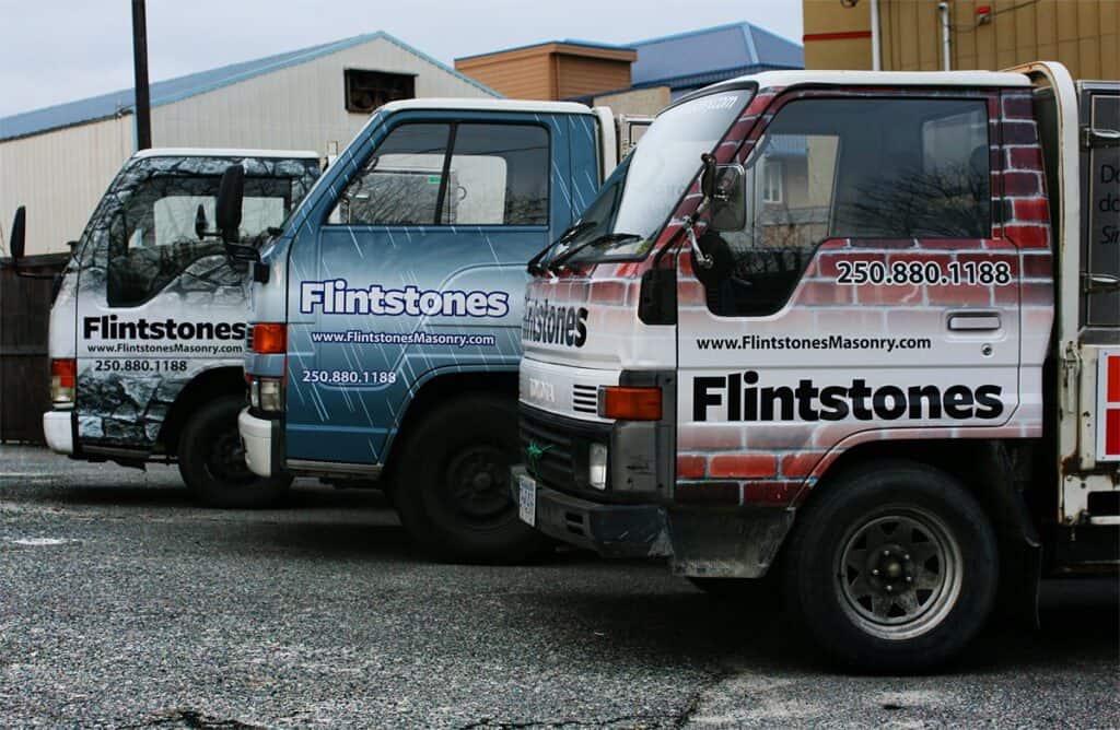 Custom Flintstones vehicle wraps for advertising in Victoria, featuring colorful stone-age designs.