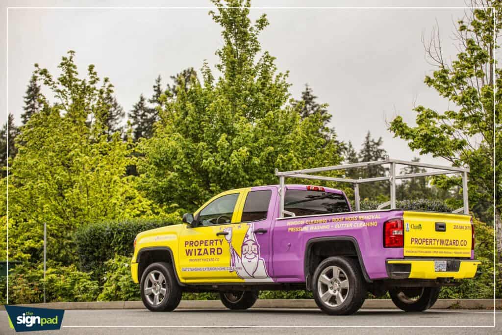 Vehicle wrap with Property Wizard branding and logo.