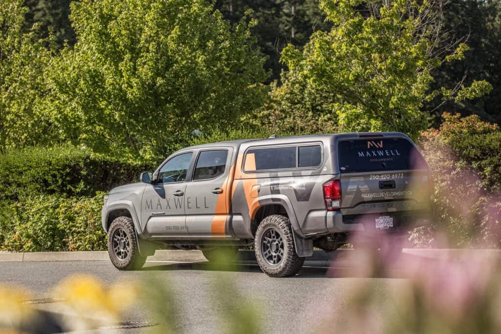 Custom vehicle wrap for Maxwell on a pickup truck in Victoria.