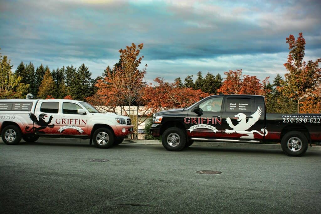 Vehicle wrap with Griffin logo and contact info.
