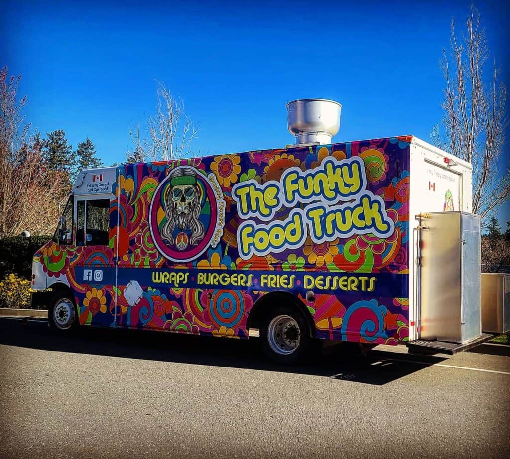 Funky Food Truck with vibrant, colorful wrap design promoting food services in Victoria.